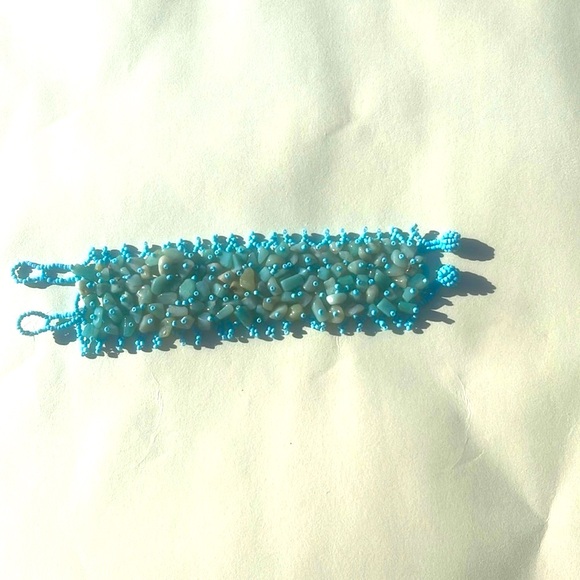 Cute bracelet! Aqua colored stones in a light blue elasticized & beaded band. - Picture 2 of 6